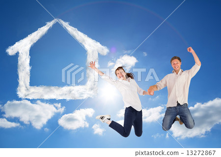 Composite image of couple jumping and holding hands 13272867