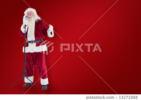 Composite image of santa sings like a superstar 13272888