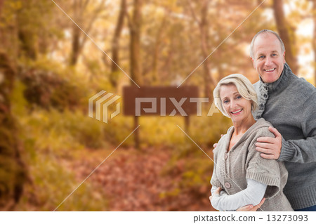 Composite image of mature winter couple 13273093