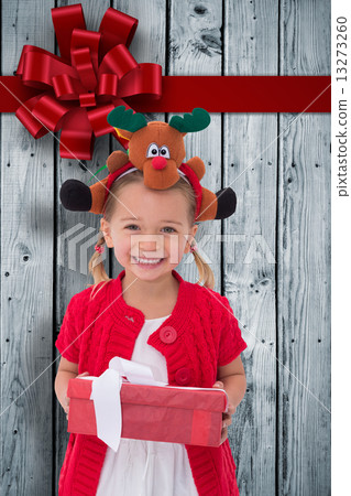 Composite image of cute little girl wearing rudolph headband Composite image of cute little girl wearing rudolph headband 13273260