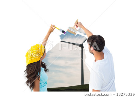 Composite image of happy young couple painting together Composite image of happy young couple painting together 13273339