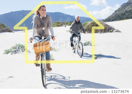 Composite image of carefree couple going on a bike ride on the b 13273674