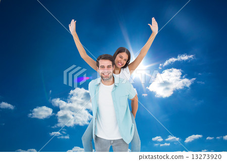 composite image of happy casual man giving pretty girlfriend