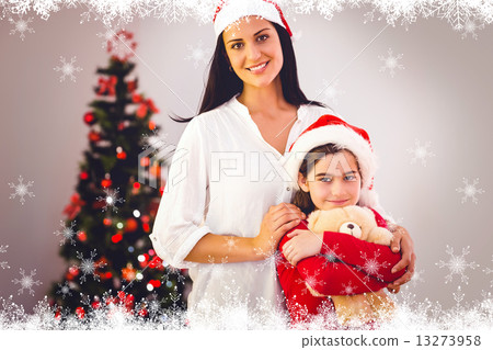 Composite image of festive mother and daughter smiling at camera Composite image of festive mother and daughter smiling at camera 13273958