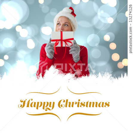 Composite image of happy festive blonde with gift Composite image of happy festive blonde with gift 13274126