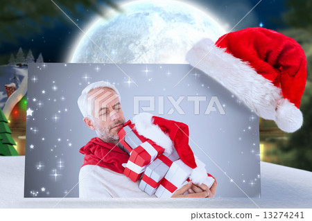 Composite image of happy festive man with gifts 13274241