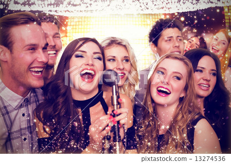Composite image of friends singing karaoke 13274536