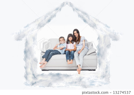 Composite image of mother with their children sitting on sofa 13274537