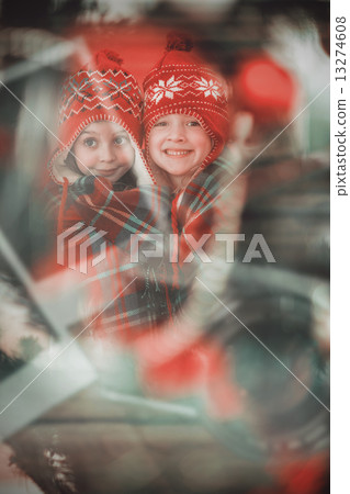 Composite image of festive little girls under a blanket Composite image of festive little girls under a blanket 13274608