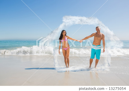 Composite image of smiling handsome man holding his girlfriends 13275054