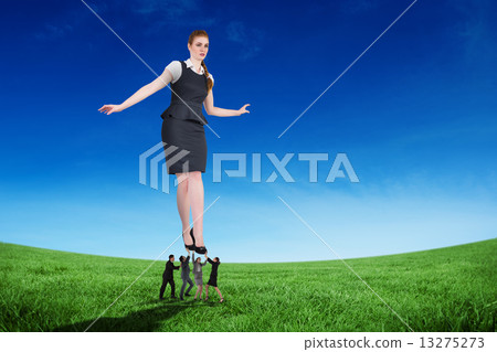 Composite image of business people supporting boss Composite image of business people supporting boss 13275273