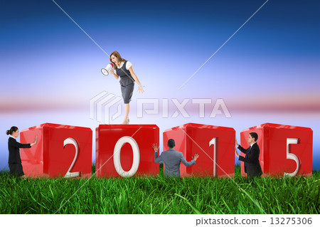 Composite image of businesswoman shouting through megaphone 13275306