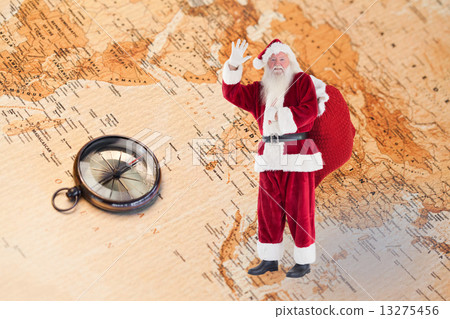 Composite image of santa waves to the camera 13275456