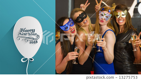 Composite image of attractive women wearing masks holding champa Composite image of attractive women wearing masks holding champa 13275753