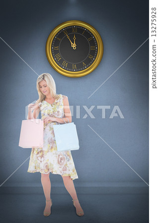 Composite image of elegant blonde with shopping bags 13275928