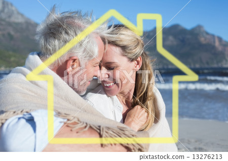 Composite image of smiling couple sitting on the beach under bla Composite image of smiling couple sitting on the beach under bla 13276213
