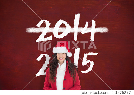 Composite image of cheerful brunette showing white poster Composite image of cheerful brunette showing white poster 13276257