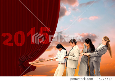 Composite image of boss pulling a rope against his employees 13276348