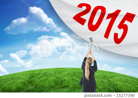 Composite image of businesswoman pulling a chain 13277390