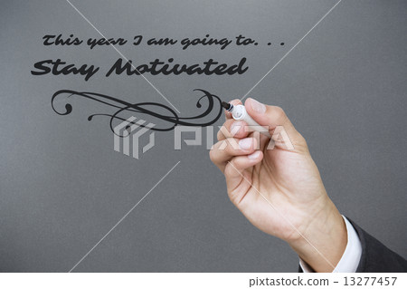 Composite image of hand holding a marker Composite image of hand holding a marker 13277457