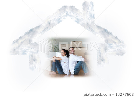 Composite image of glowing couple sitting on the floor Composite image of glowing couple sitting on the floor 13277608