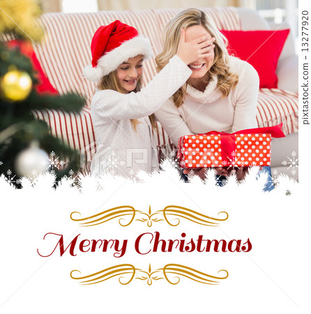 Composite image of festive mother and daughter with gift Composite image of festive mother and daughter with gift 13277920