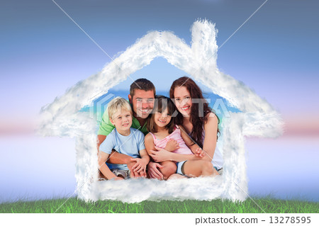 Composite image of portrait of a family at the beach 13278595