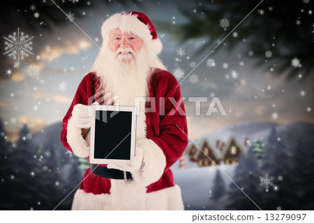 Composite image of santa presents a tablet pc Composite image of santa presents a tablet pc 13279097