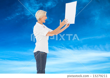 Composite image of angry woman shouting at piece of paper 13279211