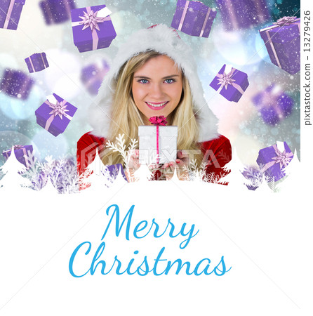 Composite image of pretty girl in santa outfit holding gift 13279426