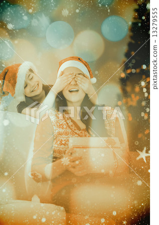 Composite image of daughter surprising her mother with christmas 13279555