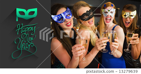 Composite image of attractive friends with masks on holding cham 13279639