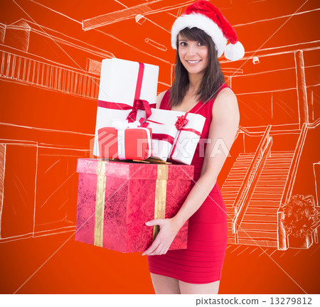 Composite image of festive brunette holding pile of gifts 13279812