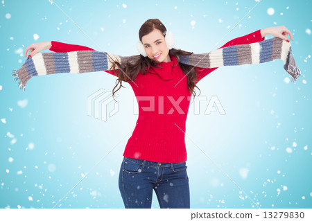 Composite image of cheerful brunette holding scarf and spread he 13279830