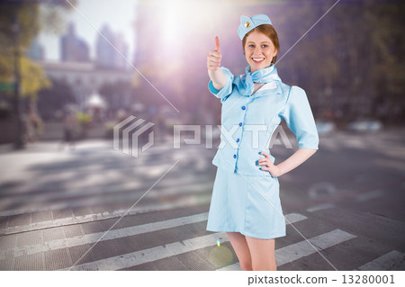 Composite image of pretty air hostess with hand on hip Composite image of pretty air hostess with hand on hip 13280001
