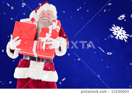 Composite image of santa carries a few presents 13280003
