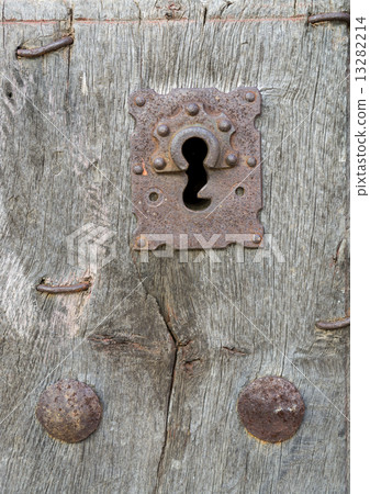 Old run-down wooden door and iron lock Old run-down wooden door and iron lock 13282214
