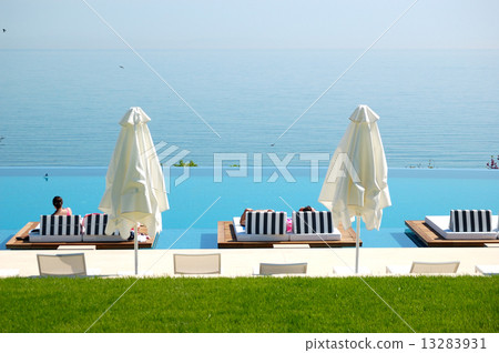 Infinity swimming pool by beach at the modern luxury hotel, Pier Infinity swimming pool by beach at the modern luxury hotel, Pier 13283931