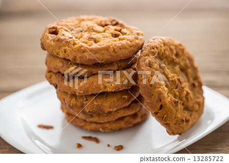 Stacked chocolate chip cookies  on wooden table 13285722