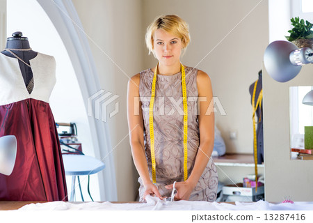 Seamstress in atelier studio Seamstress in atelier studio 13287416