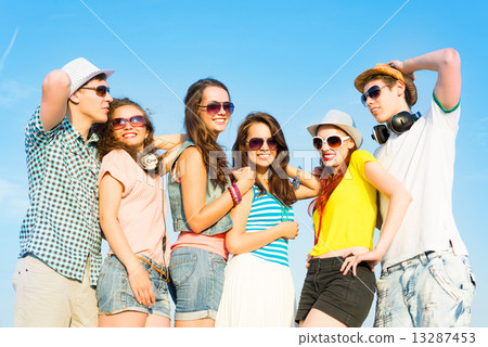 group of young people wearing sunglasses and hat group of young people wearing sunglasses and hat 13287453