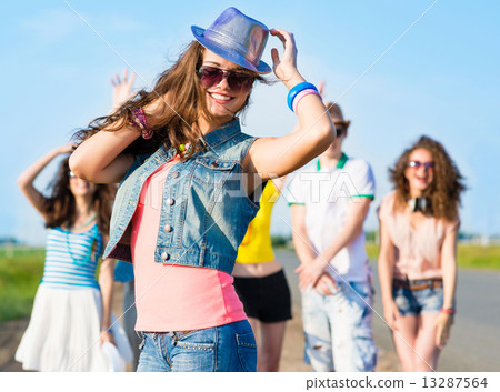 stylish young woman in sunglasses 13287564