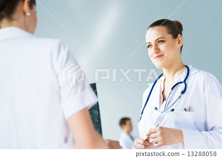 Doctor talking with a colleague Doctor talking with a colleague 13288058