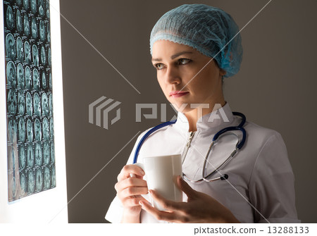 doctor looking at the x-ray 13288133