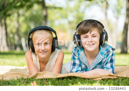 Kids wearing headphones 13288441