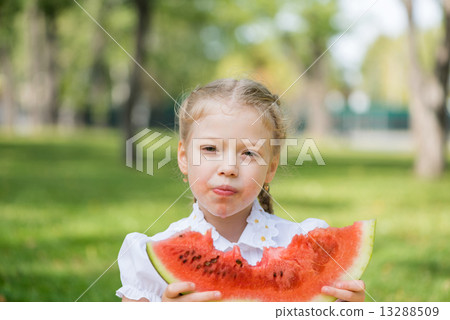 Kid with watermelon slice 13288509