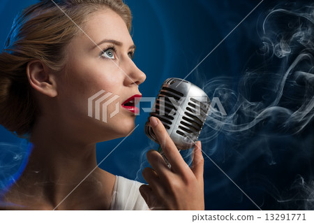 attractive female singer with microphone attractive female singer with microphone 13291771