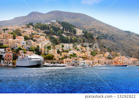 boats and houses on symi island, Greece.. 13292822