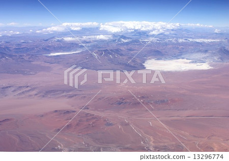 Andean mountain range which crosses the South American continent north and south, beautiful mountain ranges shining in the winter sky of clear skies and salt lake in Chile scattered in the highland 13296774