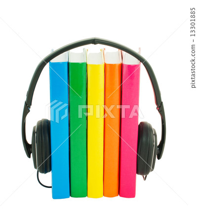Row of books and headphones - Audiobooks concept Row of books and headphones - Audiobooks concept 13301885